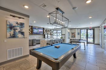 Game room with billiards and pool table
